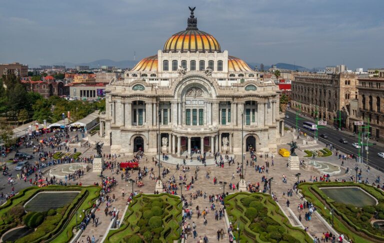 Palacio de Bellas Artes with its golden dome and gardens seen from above in central Mexico City
